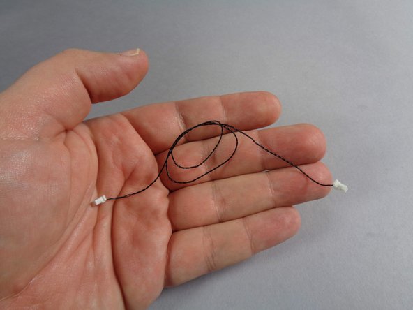 As shown in the first photo for this step, you should have at least one spare black connecting cable from the adapter boards you removed earlier in the upgrade installation process.