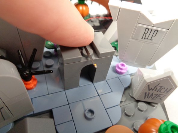 As shown by the first photo for this step, align the LED light facing upward along the center of the grave.