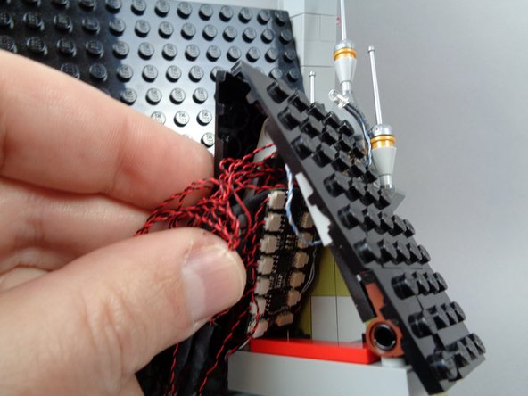 Next you will coil up the excess light wire lengths so they will fit into the small space under the front roof.