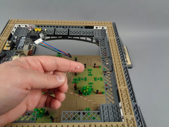 Take the final light strip pair with connected adapter board.