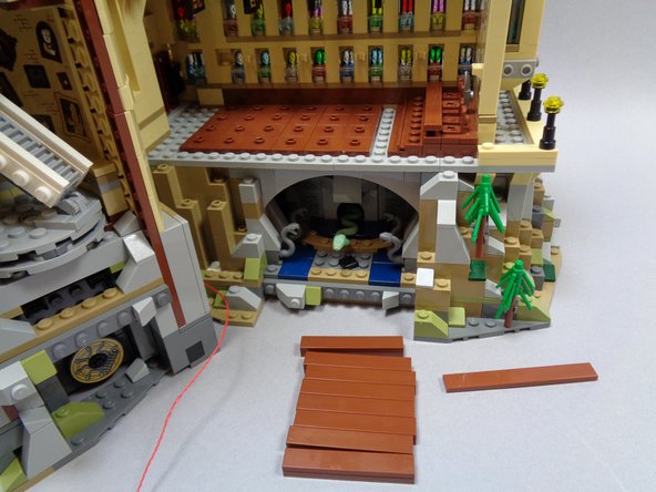 As shown in the second and third photo, remove the brown benches and also the brown tile in front of the raised chairs (blue arrows in the third photo).