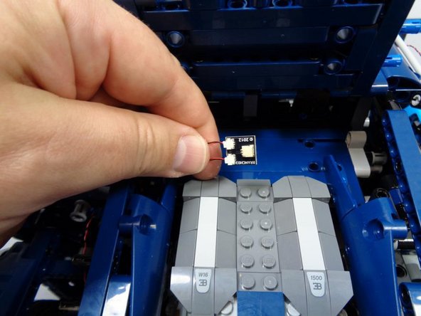 As shown in the third photo, take one of the BRANCH03 adapter boards from Bag 1 and connect both the front and rear left turn signal wires to the small connectors on the BRANCH03 board.