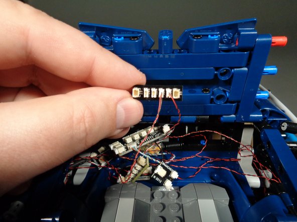 As shown in the second photo, take the BRANCH15 adapter board included with this expansion kit and connect the two light strip wires to any two of the center small plugs on the BRANCH15 board.