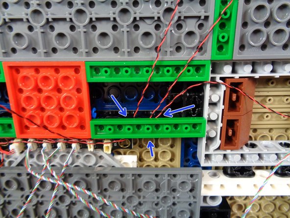 As shown in the first photo, you can use the &quot;boat stud&quot; parts to hold the spotlight wires in place.  Just make sure all wires run between, not on top of, any studs.