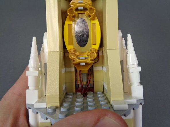 As shown in the second photo, re-attach the mirror.