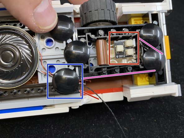 As shown in the second photo, connect the 6&quot; black connecting cable to one of the plugs on the BRANCH04 adapter board, and attach it to the bottom rear of the car using a sticky square.
