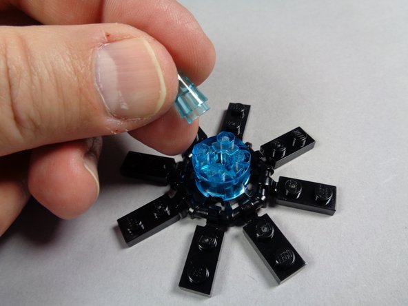 Also as shown in the third photo, remove the center transparent blue cone from the top of each engine.