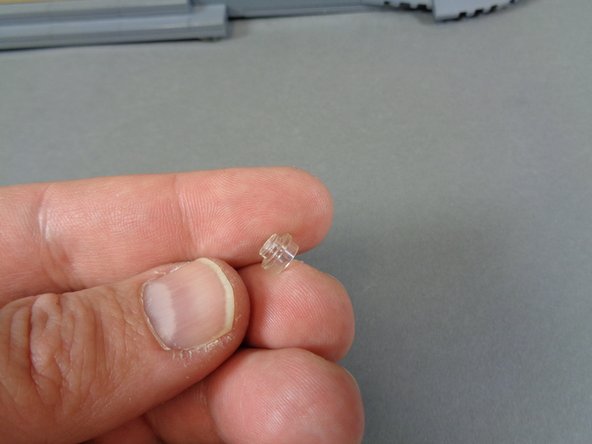 As shown in the first and second photos, remove the LED light with 6&quot;/15.2cm wire and also the transparent round 1x1 LEGO plate from the &quot;Lower Level Lights and Parts&quot; bag.