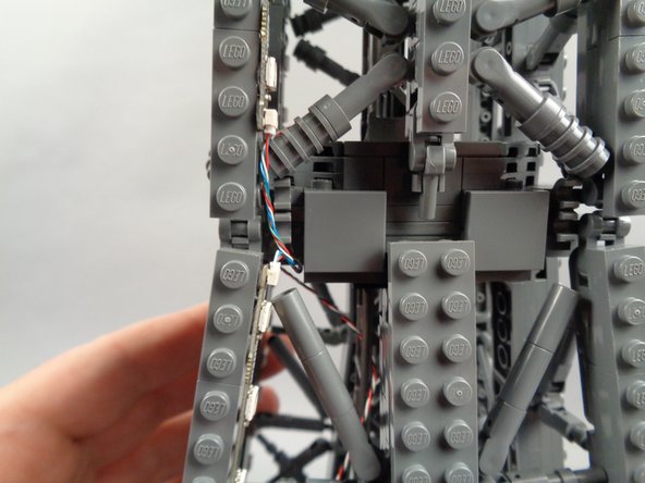 As shown in the photos for this step, you can use the tweezers to tidy up any visible sections of wire connecting the 17-LED sections and 20-LED sections of both light strips.