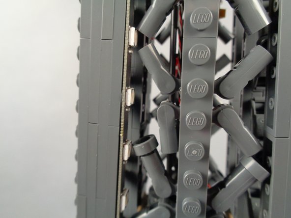 Go slowly, and re-position elements as needed.  In cases where brace elements have multiple round plates attached, you can remove one or more of these extra parts to make the brace elements shorter and to make more room for the light strip.