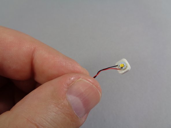 Next you will attach the front interior light, which mounts in the center of the bottom side of the front roof section.