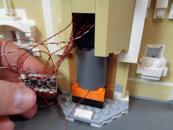 As shown by the photos in this step, re-attach the stove.