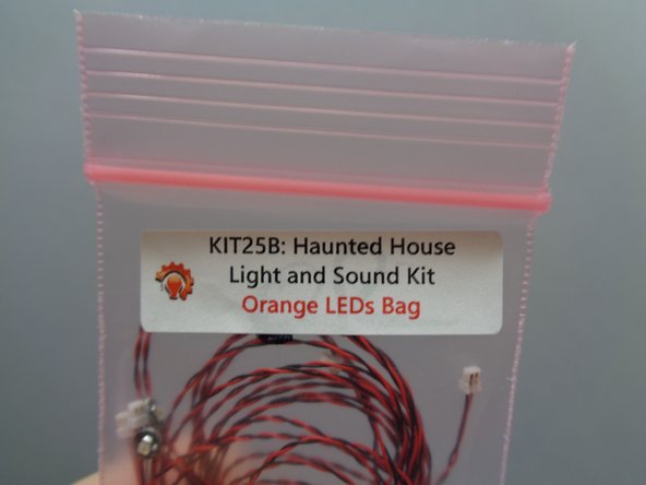 Take the small &quot;Orange LEDs Bag&quot; out of Bag 2, and remove the two lights with 18&quot; (45.7cm) wires.  These will be the lights with the longest wires in the bag of orange lights.