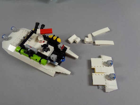 The second photo shows the front roof section being removed after loosening the studs on the top center of the windshield.