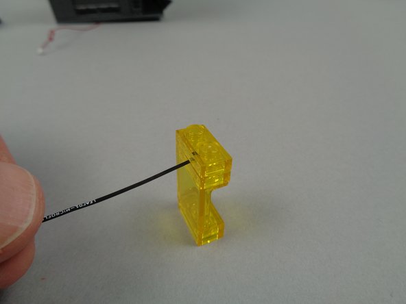 As shown by the blue arrow in the second photo, make sure to position the LED light while the flat part (the front) of the window element is facing your hand.  The wires for the light should extend out beyond the front of the window.