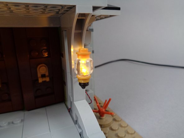 Using the same testing procedure you used for the fireplace light, connect the wire for the first front porch light to the small plug on the testing board connected to the USB cable.