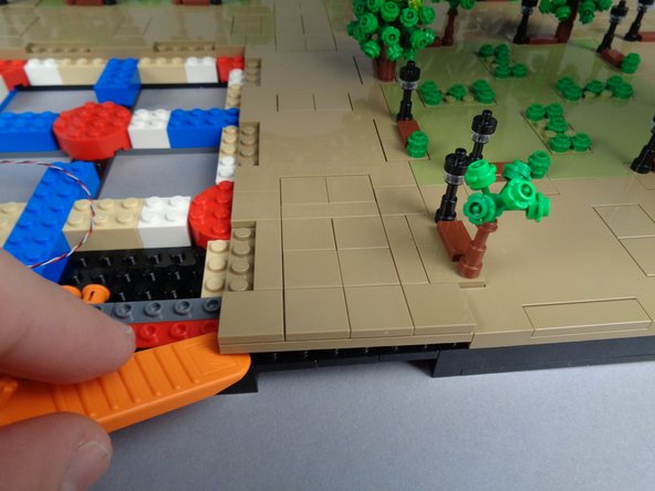 As shown in the first and second photos for this step, remove the small panel between Sections 2 and 3 (this is the small panel next to Panel 2R).