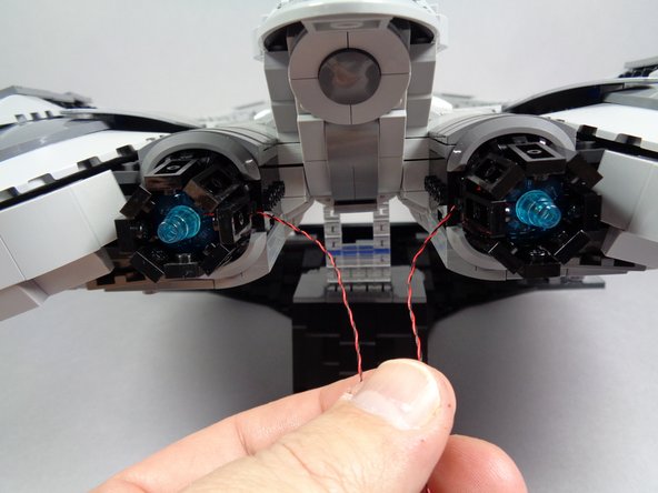 When re-attaching the engines, make sure the light wires for each pass on the inner side, toward the center of the Raider.