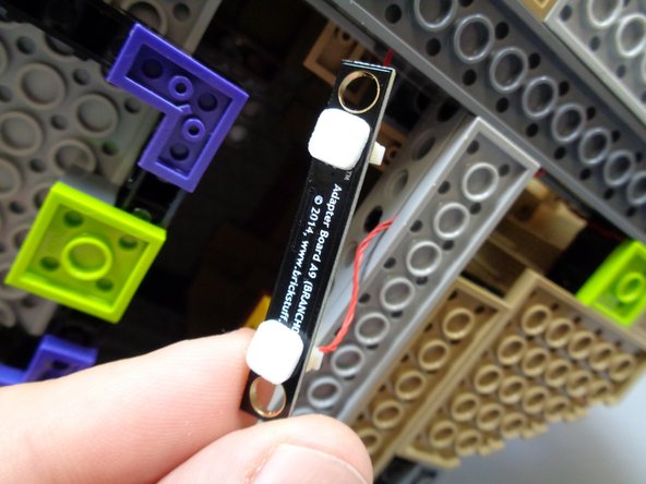 There should already be another red control wire attached to the other plug on the BRANCH09 adapter.  You should connect the tower wire to the large plug on the BRANCH09 closest to the three small plugs.