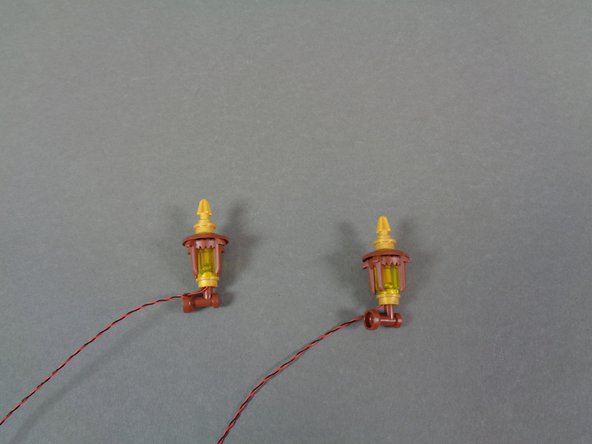 As shown in the second photo, re-attach the top section of the torch.