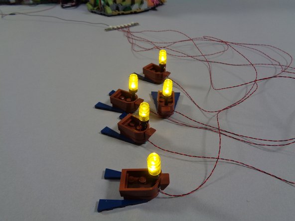 As shown in the first photo, connect the other end of the boat lighting cable to one of the open plugs on the BRANCH18 adapter