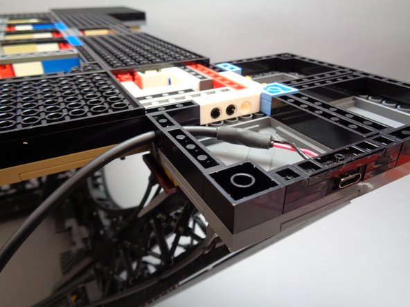 The second and third photos for this step show how the power input connector and wire should look when you are done.