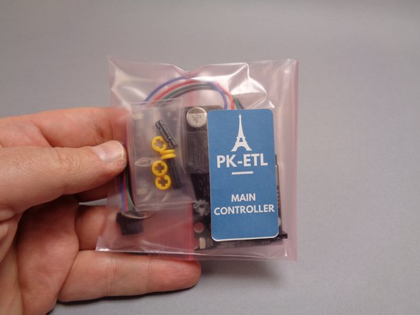 As shown in the first photo for this step, you will now connect the main controller, which is supplied in a large pink bag labeled "MAIN CONTROLLER."