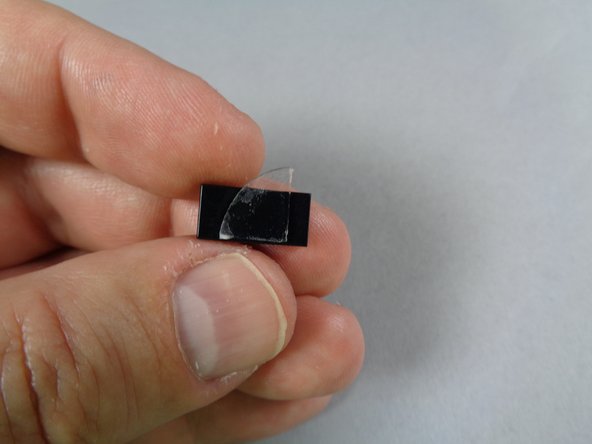 As shown by the green line in the first photo, make sure the glue disc does not extend beyond the edge of the tile.