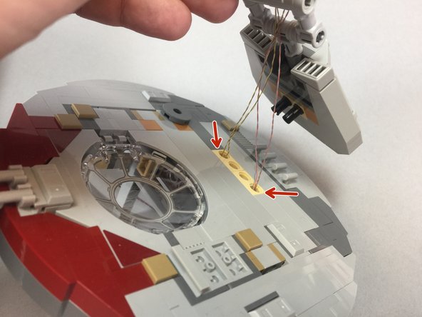 Now you will re-attach the top laser cannon to the main turret.