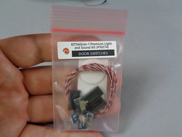 One of the unique features of your Ecto-1 kit is the realistic door opening and closing sounds triggered by the small switches included.