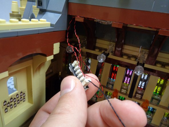 As shown in the third photo, take the 12&quot; connecting cable from Bag 6 and connect it to one of the large plugs on the BRANCH15 adapter board.
