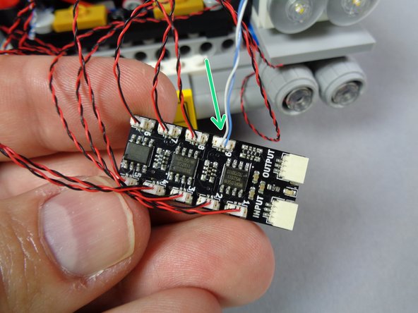 As shown by the green arrow in the first photo, connect the speedometer light wire to plug #9 on the BRANCH09X adapter.