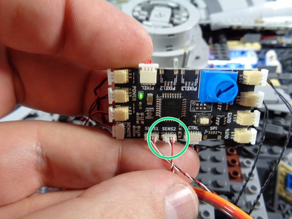 Note: depending on when your kit was made, your TRUNK08 master controller may look different than the one in the photo.  This is ok-- all versions of the controller have a &quot;SENS2&quot; connector.