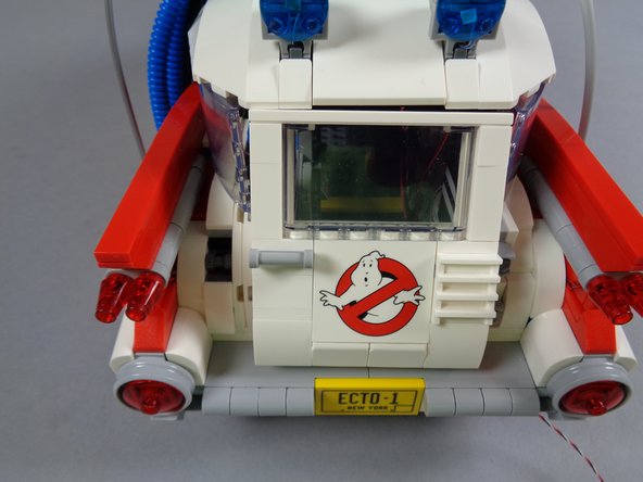 As the green line in the first photo shows, make sure to align the edge of the glue disc so it does not extend beyond the front edge of the switch.