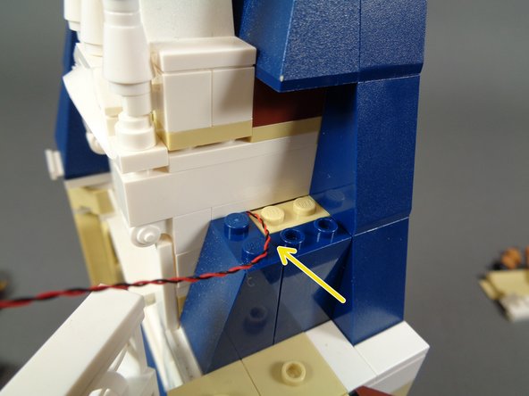 As shown by the dotted orange line in the second photo, make sure the light wire runs down and toward the left side of the bedroom, and also make sure the light wire runs between, not on top of, any studs.