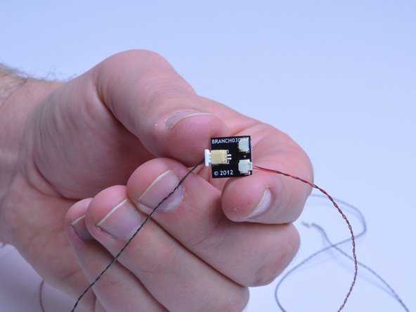 Connect each Micro Light Board to an A3 adapter board.  Add a connecting cable to the large connector on the A3 board.  You should have two A3 boards and two black connecting cables when done.