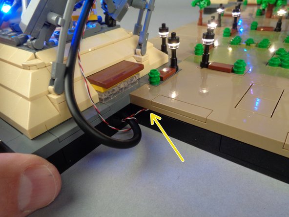 Work slowly as you re-attach the panel, making sure no LED light wires stick out or get pinched as you press down on the panel. The only visible wire should be the 3-wire control cable that passes up to the main controller.