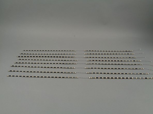 When you are finished connecting strips, you should have eight sets as shown in the third photo for this step.