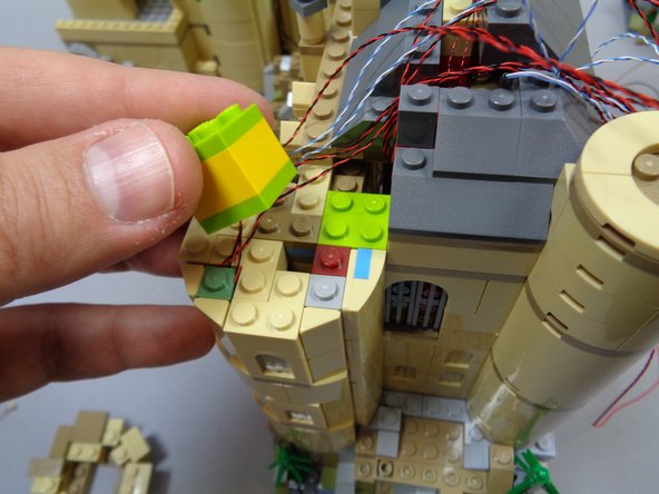 You will now prepare to re-attach the top section of the tower.