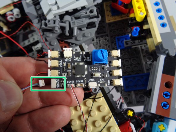 As shown by the green rectangle in the second photo, connect the smaller plug coming from the RF receiver to the plug on the TRUNK08 controller labeled &quot;REMOTE.&quot;