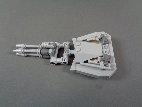 As shown in the first two photos for this step, remove the top laser cannon from the large round turret, and disassemble the cannon as shown in the second photo.