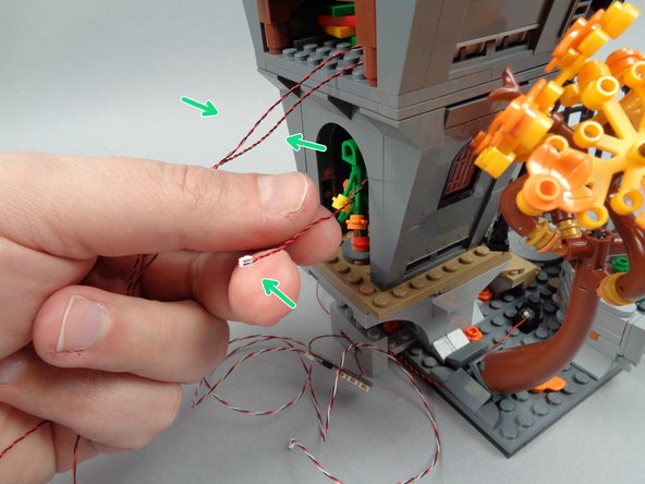 Because the light wire for the front door light now passes through the house, the clutch power for the studs holding the second floor in place will be slightly weaker than they were before.  Be careful when lifting or moving Jack's house so the second floor doesn't come loose and pull the wires.