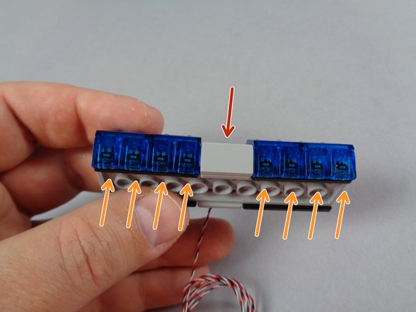 As shown in the first photo for this step, remove the 20 pieces shown from each of the original lightbars that came with your LEGO set.