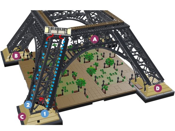 Next, you will rotate your Eiffel tower in a clockwise direction again-- this is the same direction the loose control cable from the previous step is pointing toward.