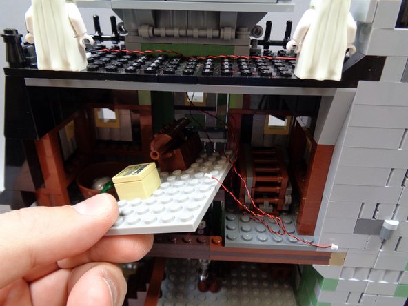 As shown in the third photo, carefully remove the large section of attic floor.