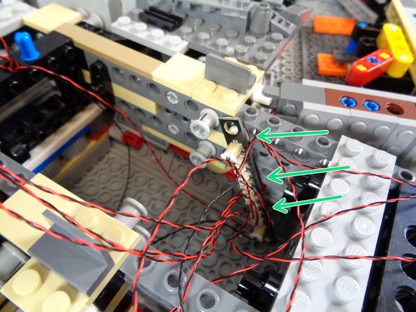 As shown in the second photo, connect the other end of the 12&quot; connecting cable to one of the large plugs on the BRANCH10/A10 adapter board, then connect the remaining eight landing lights to the small plugs on the adapter board.