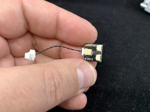 As shown in the second photo, connect the 1.5&quot; black connecting cable to the large connector on the BRANCH03 adapter board included with your kit.