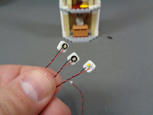 Those of you who purchased the interior lighting kit will have a bag inside the Interior Lights box that is labeled 'Upper Level Interior Lights and Parts.&quot;  Inside that bag will be three Pico LED lights: one warm white light, one blue light, and one red light.