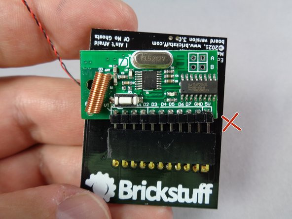 Take the main controller and turn it over, as shown in the second photo.  There should be a green circuit board plugged into the main controller with 11 pins.