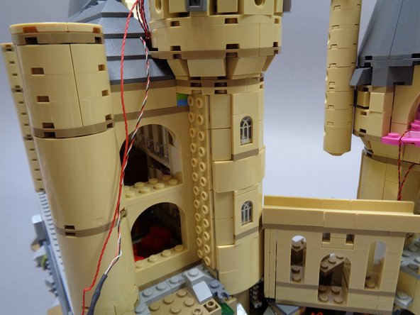 As shown in the first photo, you should now have removed all of the tan slopes from the rear of the tower.